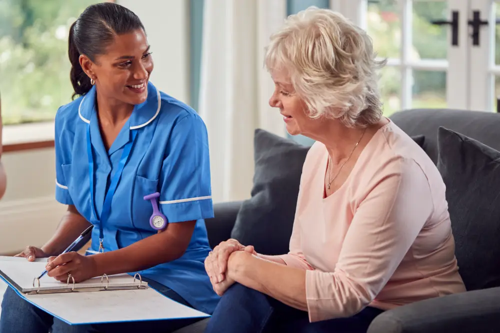 Travelling nurse advising a patient